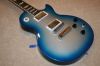 Filename=2007_Gibson_Les_Paul_Robot_BlueBurst.JPG
Filesize=289KiB
Dimensions=1024x683
Date added=Apr 07, 2008 2007_Gibson_Les_Paul_Robot_BlueBurst.JPG